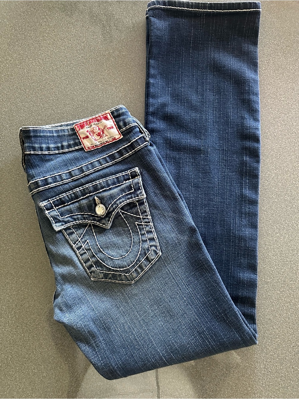 True Religion Dark Blue Jeans with Contrast Stitching and crystal button details